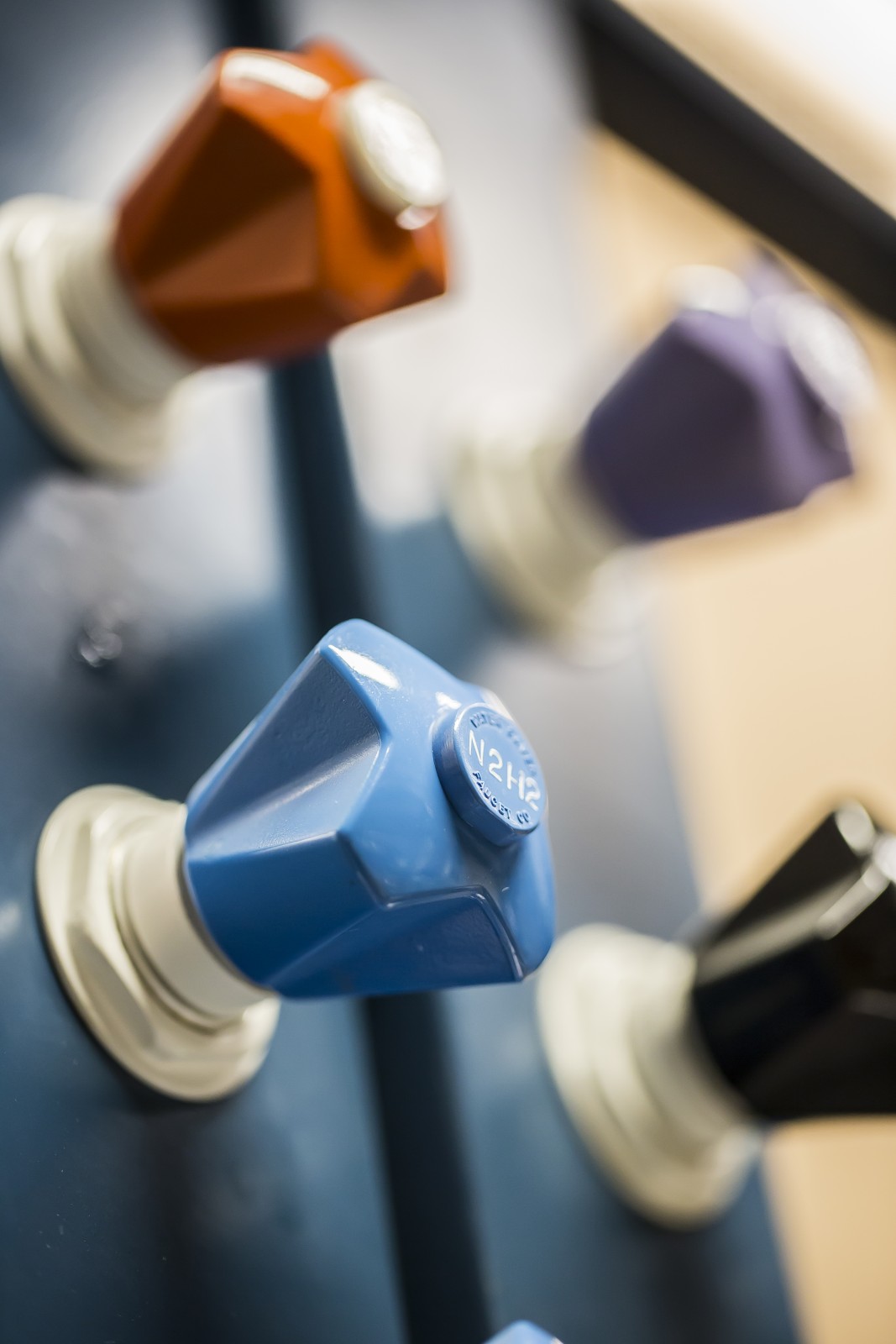 Close up of colorful knobs.